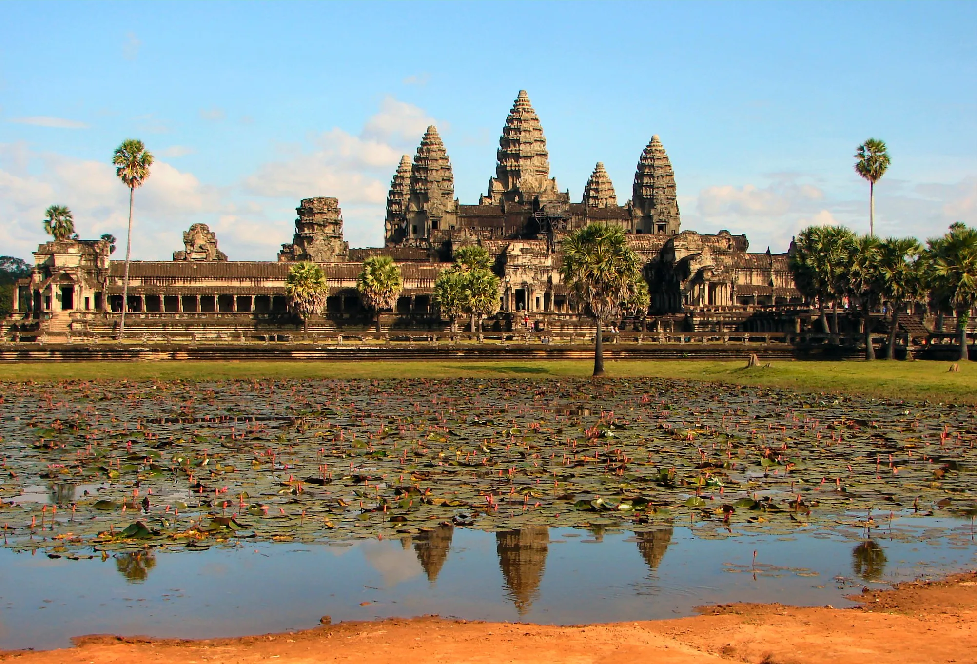 Real photo: Angkor Wat's five towers above the lotus pool.