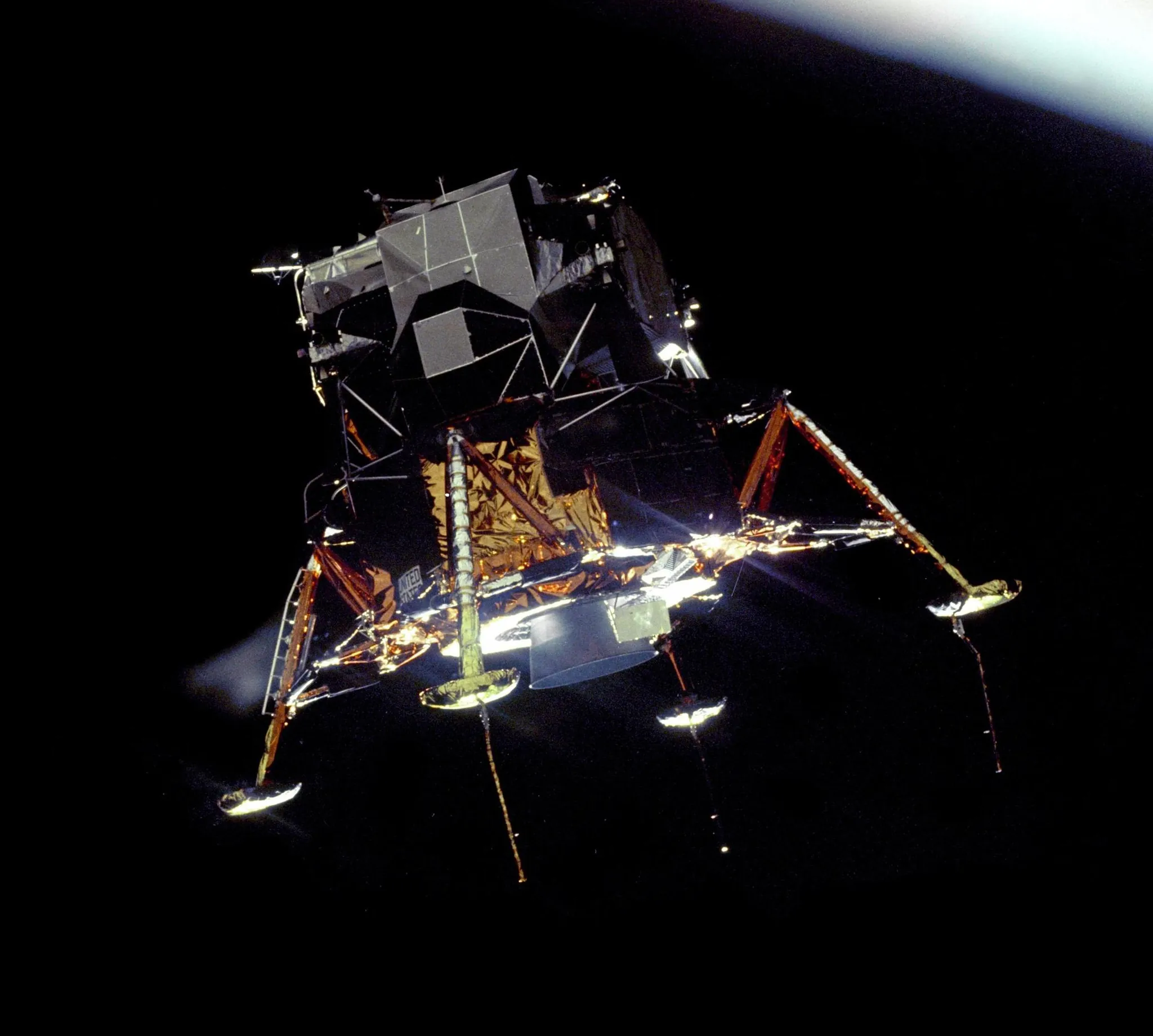 Real photo: The Lunar Module Eagle in lunar orbit, photographed from Columbia, July 20, 1969.