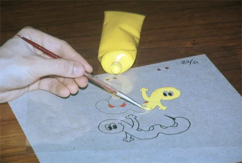 Real photo: Paint going onto the back of a clear animation cel.