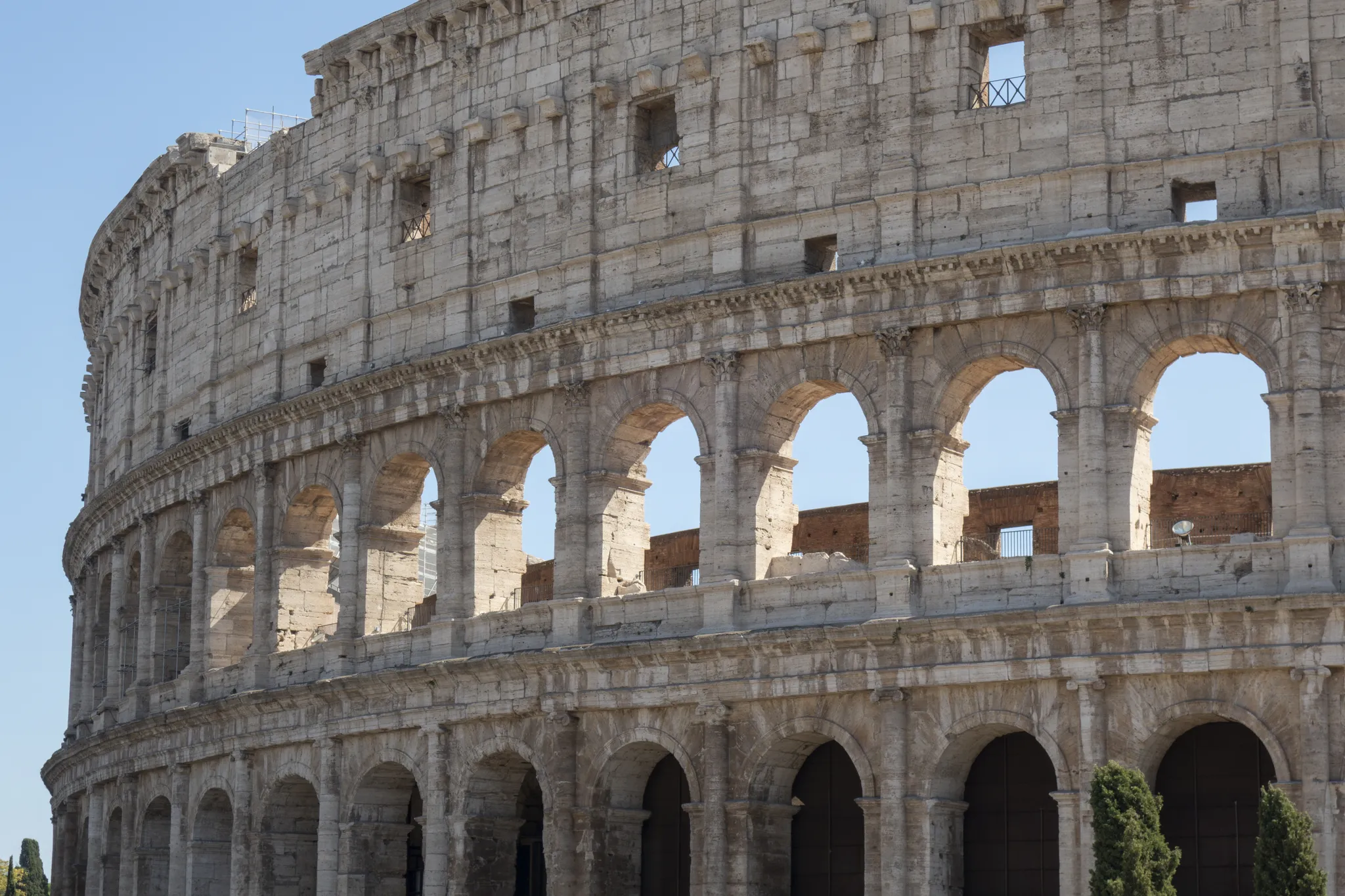 Real photo: The Colosseum's outer wall: tiers of travertine arches.
