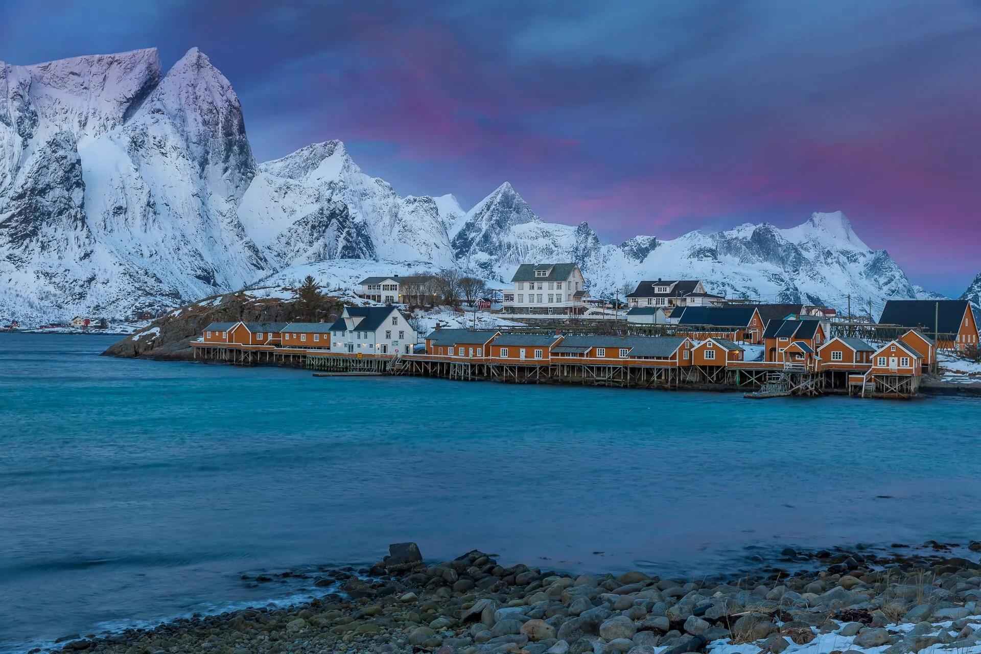 Real photo: Fishing cabins and peaks in Lofoten.