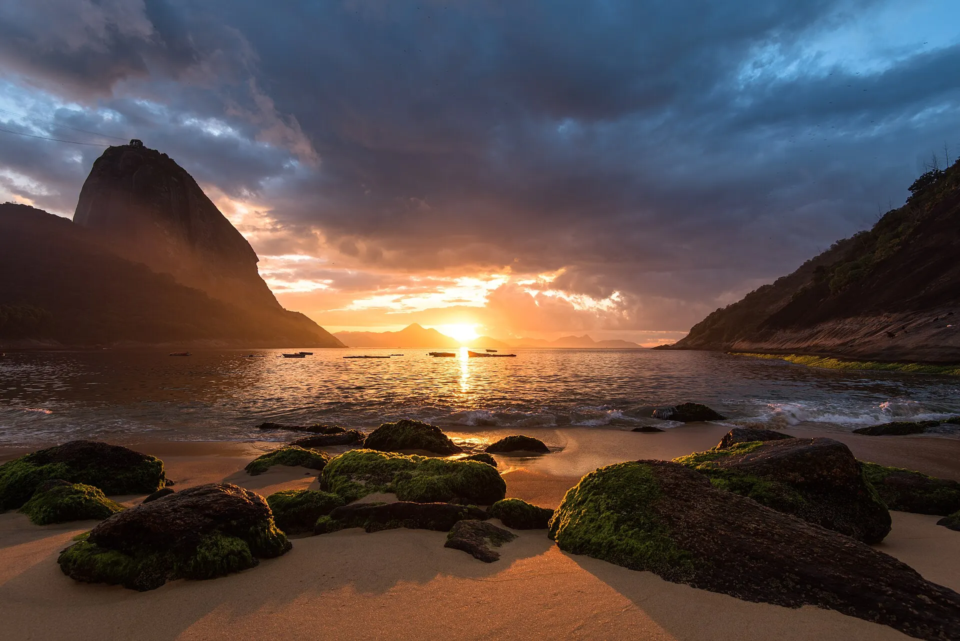 Real photo: Sugarloaf Mountain at sunset over the bay.
